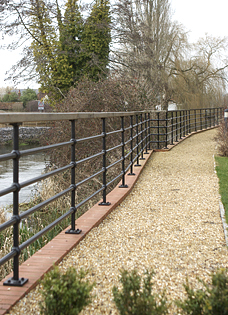 painted iron rails along riverside in Hampshire
